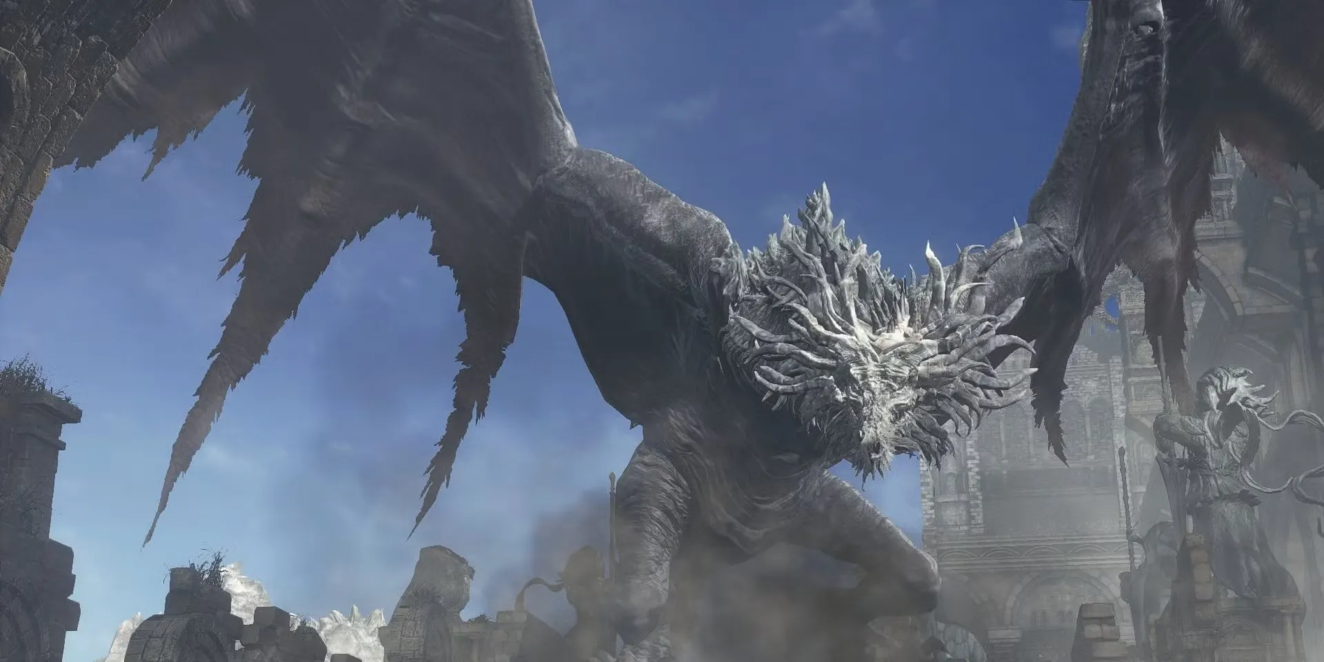 Ancient Wyvern trong Dark Souls 3, con rồng khổng lồ nơi mà khu vực chiến đấu cũng là một phần của cơ chế boss.
