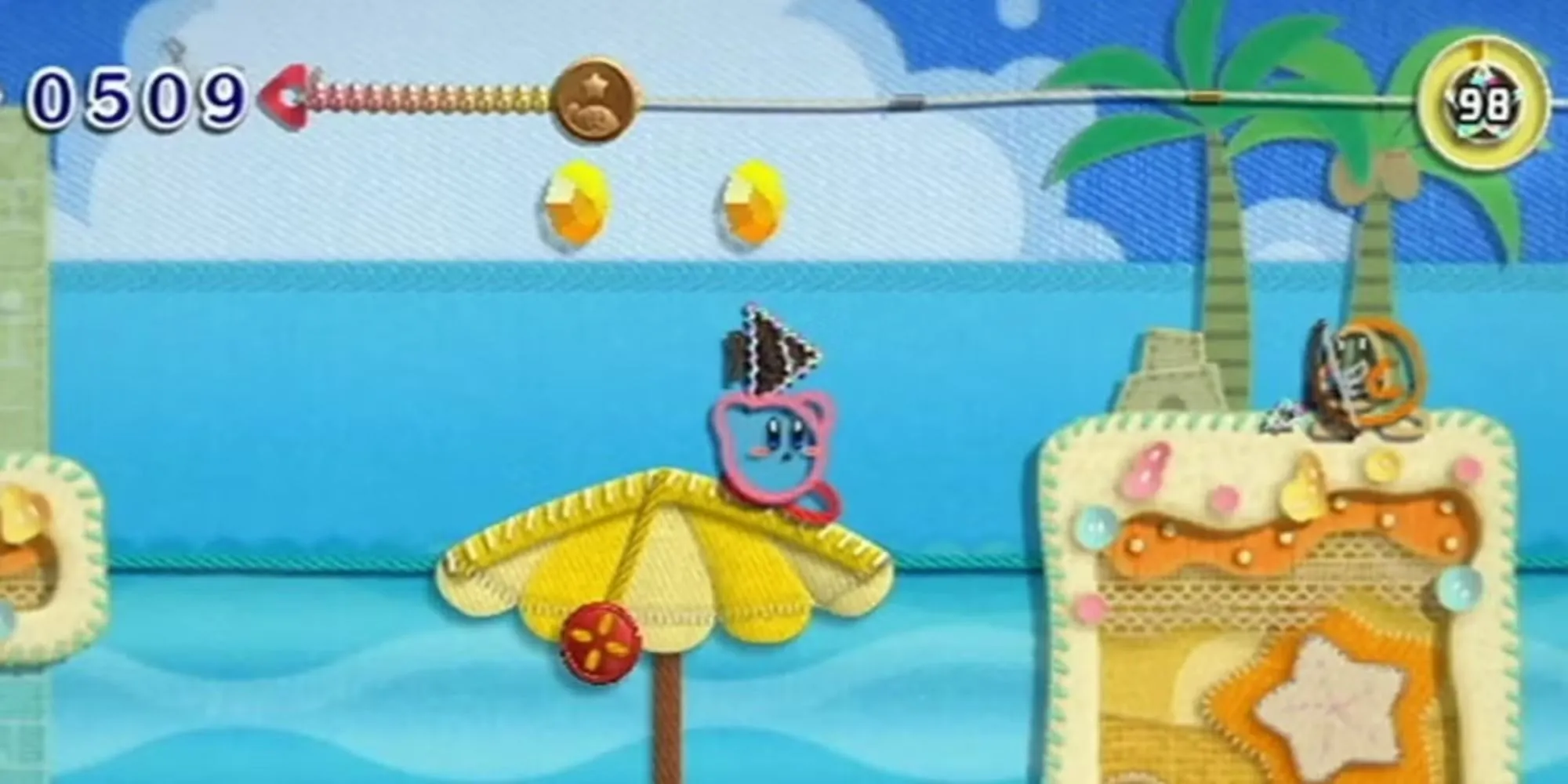 Kirby nhắm mục tiêu vào một cung thủ Waddle Dee trong Kirby's Epic Yarn