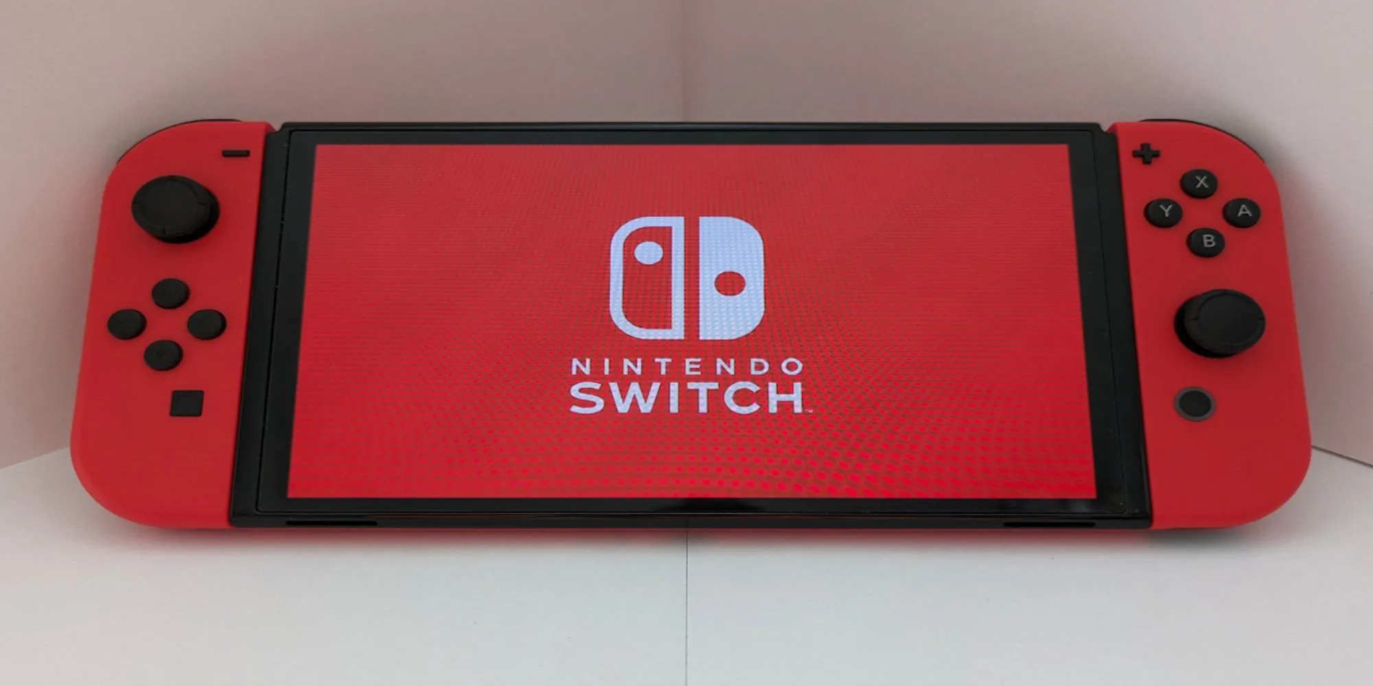 Máy chơi game Nintendo Switch màu đỏ hỗ trợ game mới đến 2026