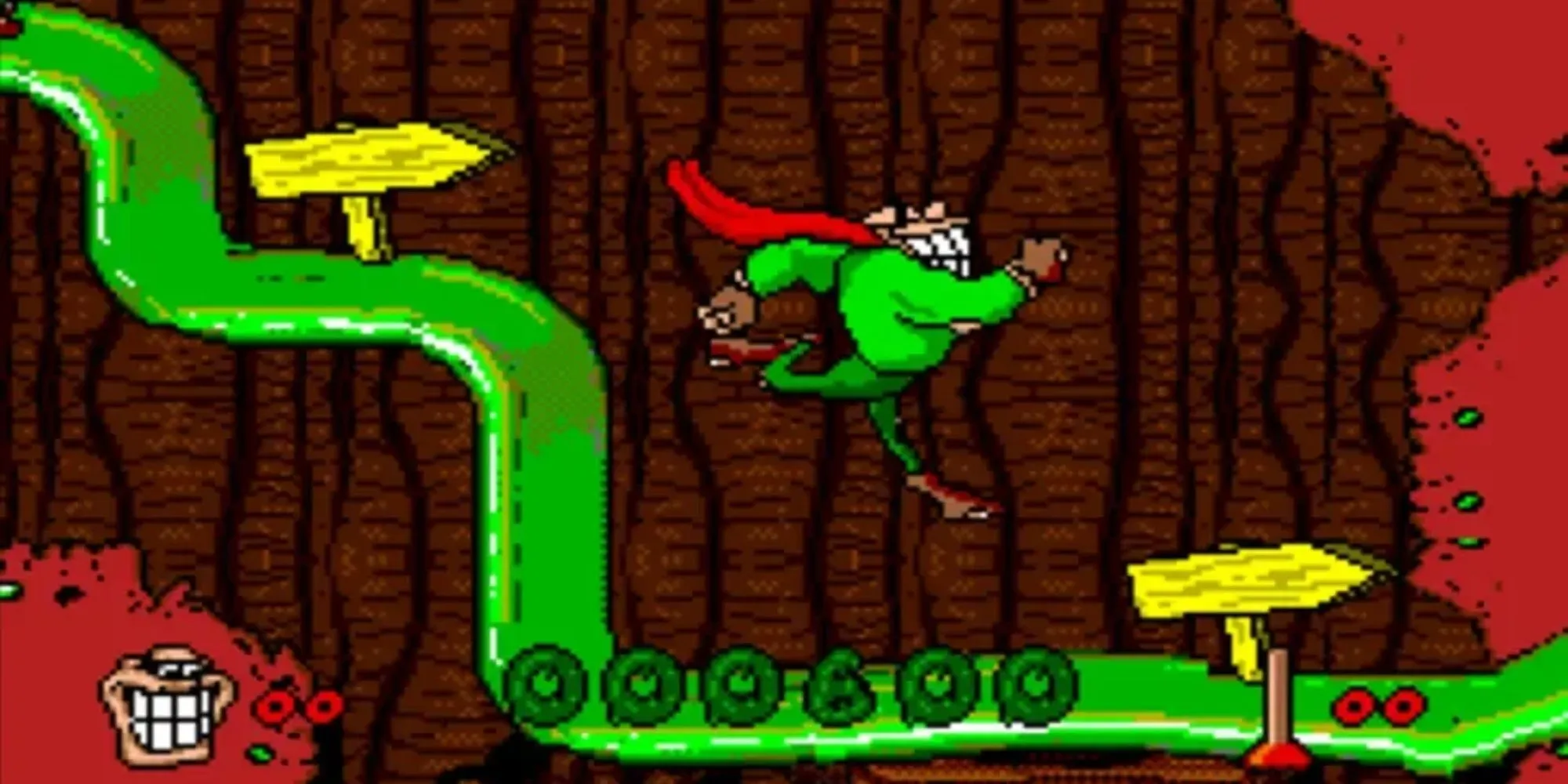 Nhân vật Boogerman sử dụng kỹ năng trong game Boogerman: A Pick and Flick Adventure trên SNES